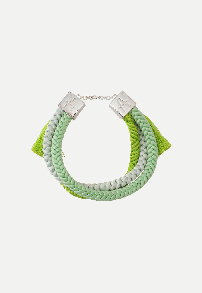 bracelet in different shades of green made from vintage silk obijime cords and sterling silver