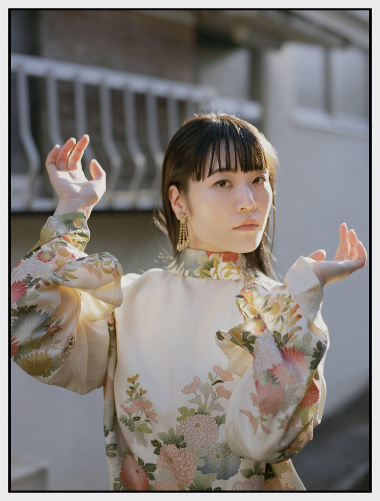 woman wearing multi-coloured floral kimono jacket 